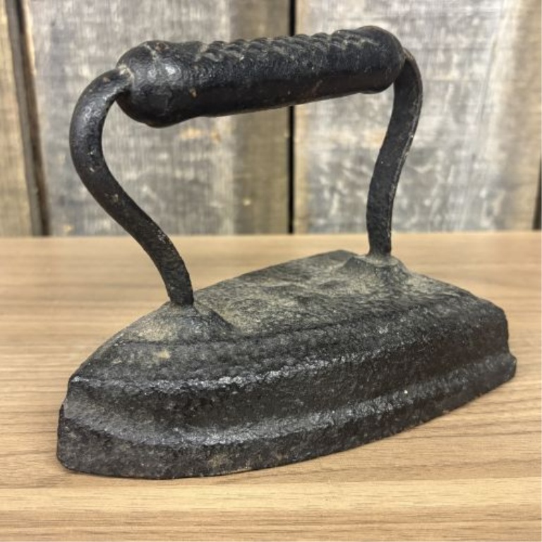 Set of Four Antique Cast Iron Sad Irons including Southern Queen Manufacturing Company