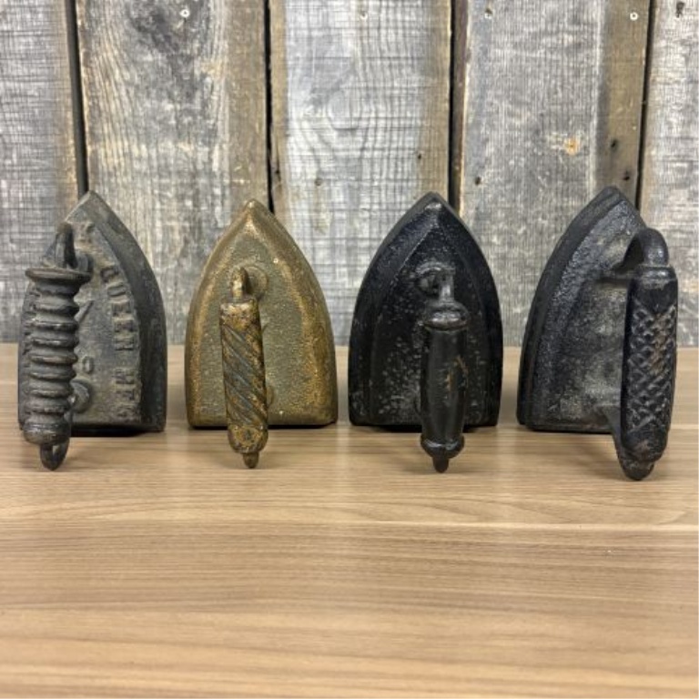 Set of Four Antique Cast Iron Sad Irons including Southern Queen Manufacturing Company