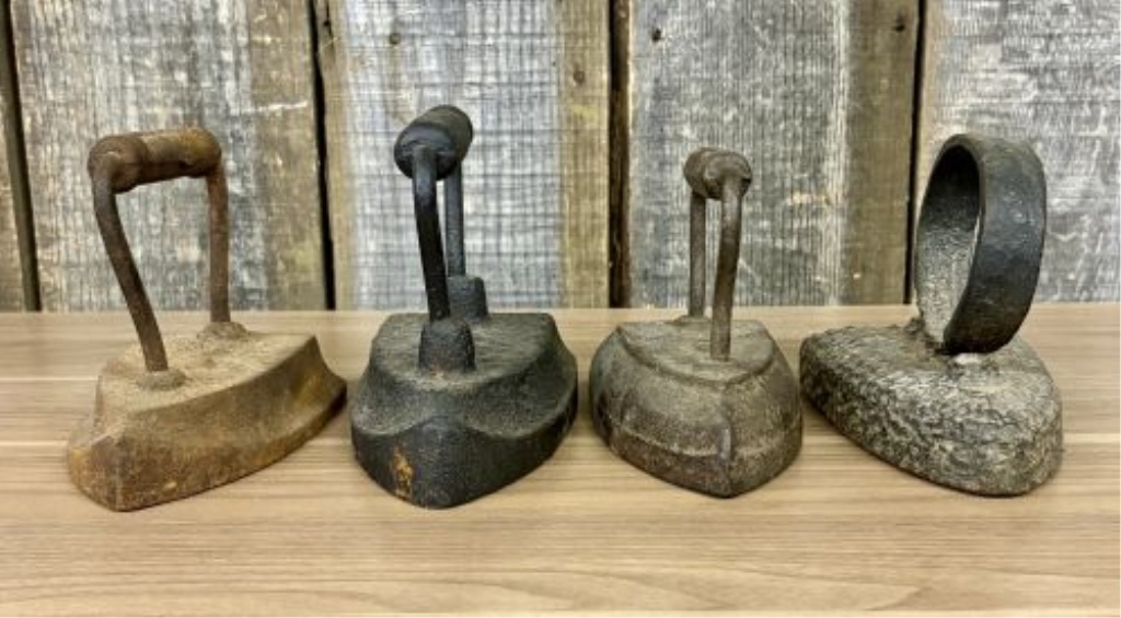 A Group of Four Antique Cast Iron Sad Irons Including Colebrookdale and Wapak Examples