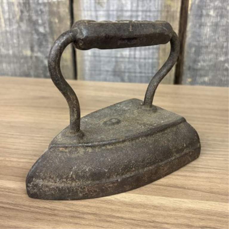 A Group of Four Antique Cast Iron Sad Irons Including Colebrookdale and Wapak Examples