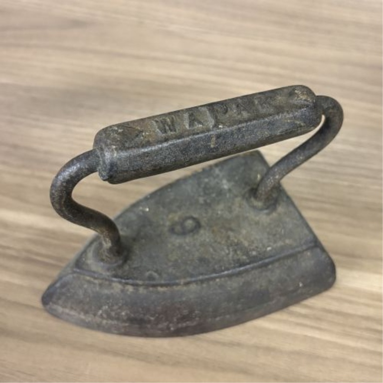 A Group of Four Antique Cast Iron Sad Irons Including Colebrookdale and Wapak Examples