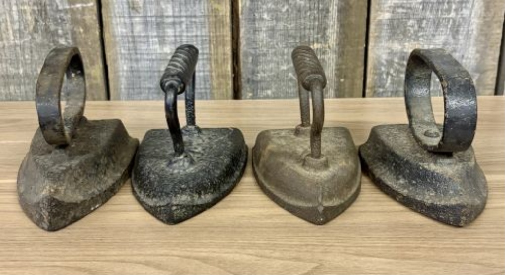 A Set of Four Antique Cast Iron Sad Irons