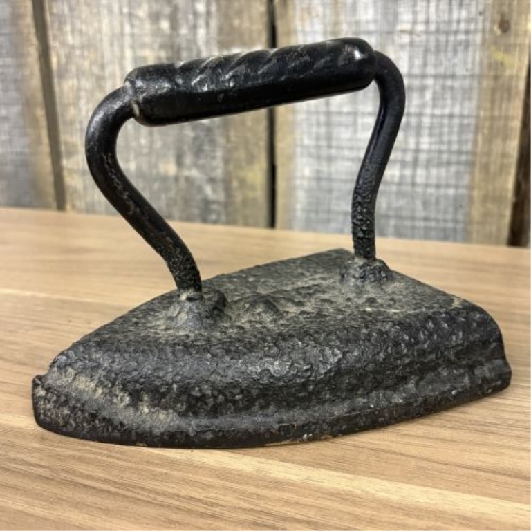 A Set of Four Antique Cast Iron Sad Irons