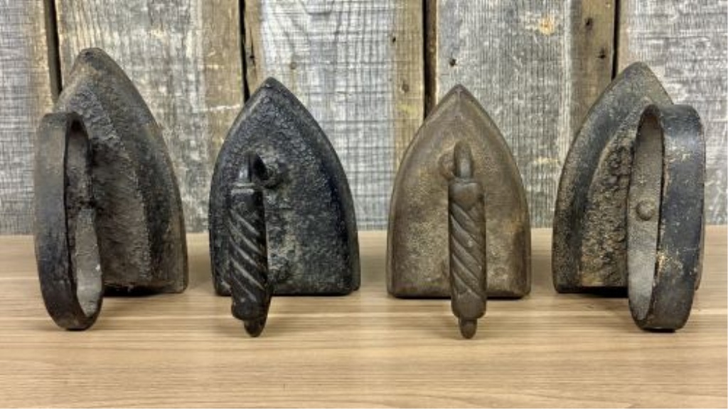 A Set of Four Antique Cast Iron Sad Irons