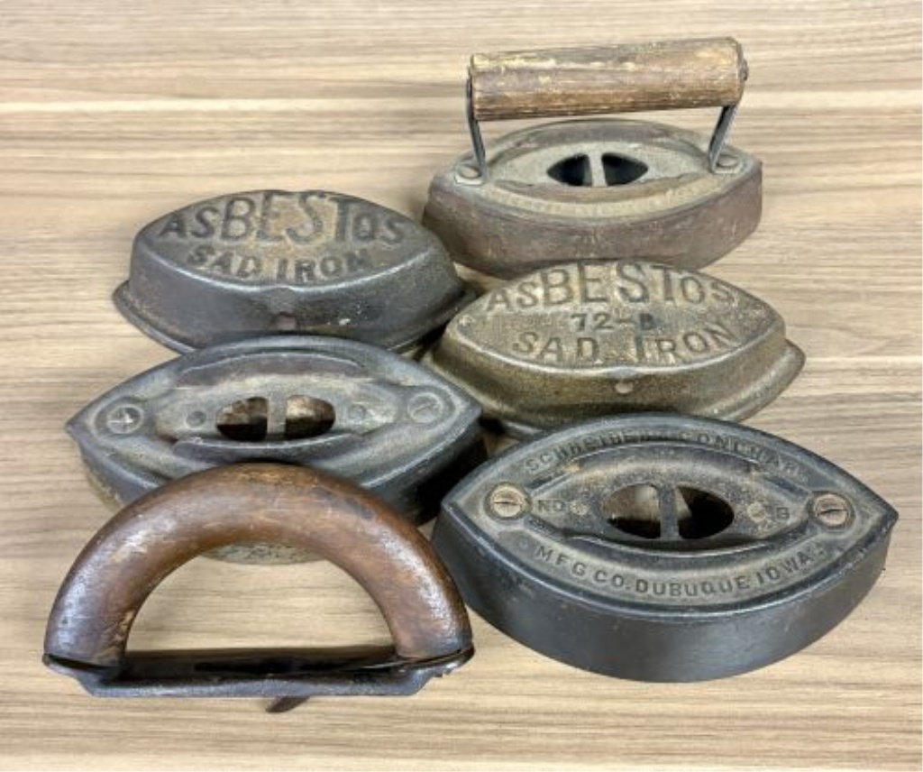 A Collection of Antique Cast Iron Asbestos and Schreiber and Conchar Sad Iron Bases and Handles