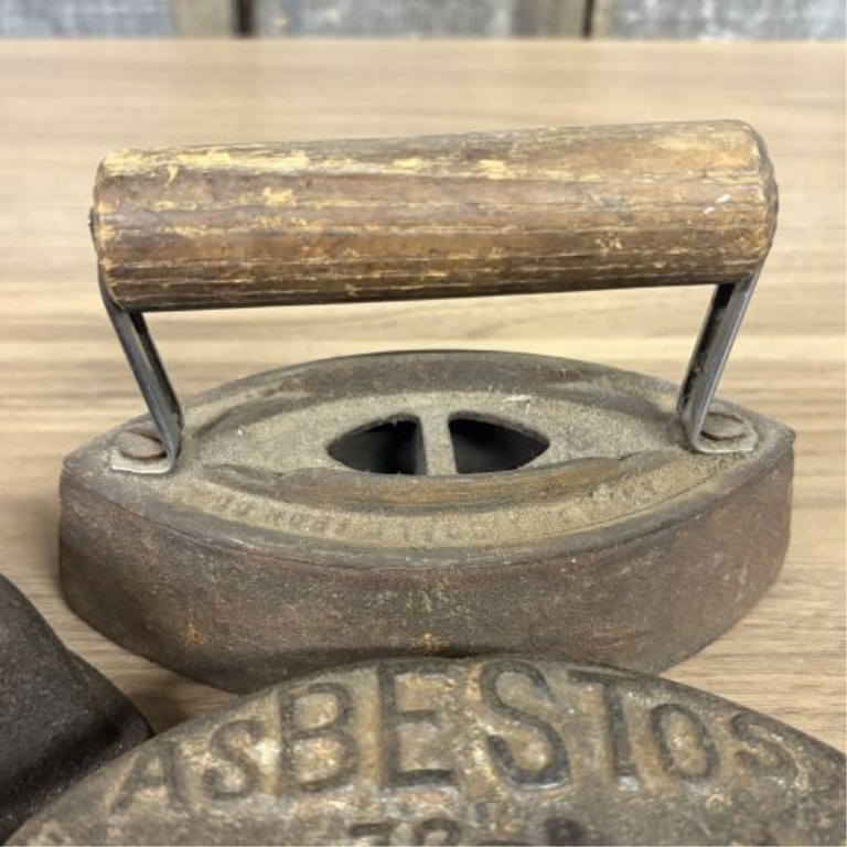 A Collection of Antique Cast Iron Asbestos and Schreiber and Conchar Sad Iron Bases and Handles