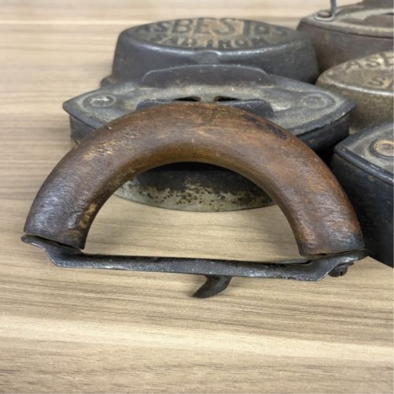 A Collection of Antique Cast Iron Asbestos and Schreiber and Conchar Sad Iron Bases and Handles