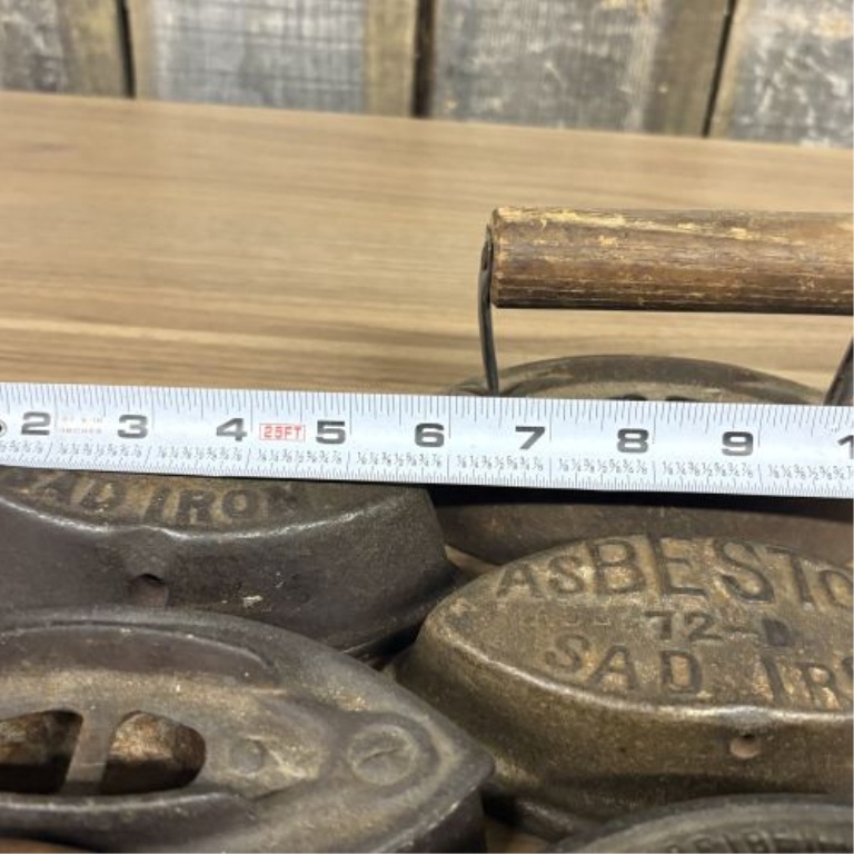 A Collection of Antique Cast Iron Asbestos and Schreiber and Conchar Sad Iron Bases and Handles