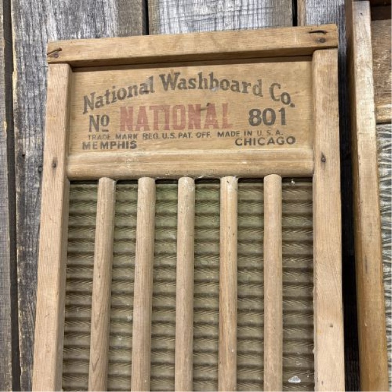 A Trio of Vintage American Wooden Washboards including National No. 801 and The Brass King
