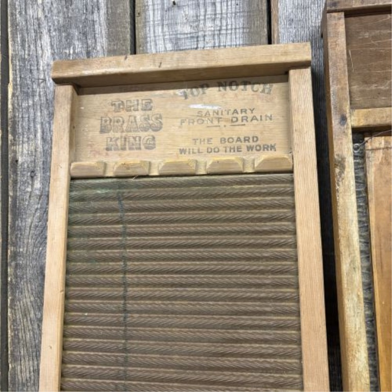 A Trio of Vintage American Wooden Washboards including National No. 801 and The Brass King