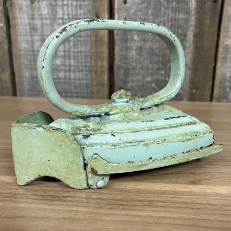 A Pair of Antique Cast Iron Miniature Sad Iron and Matching Footed Trivet