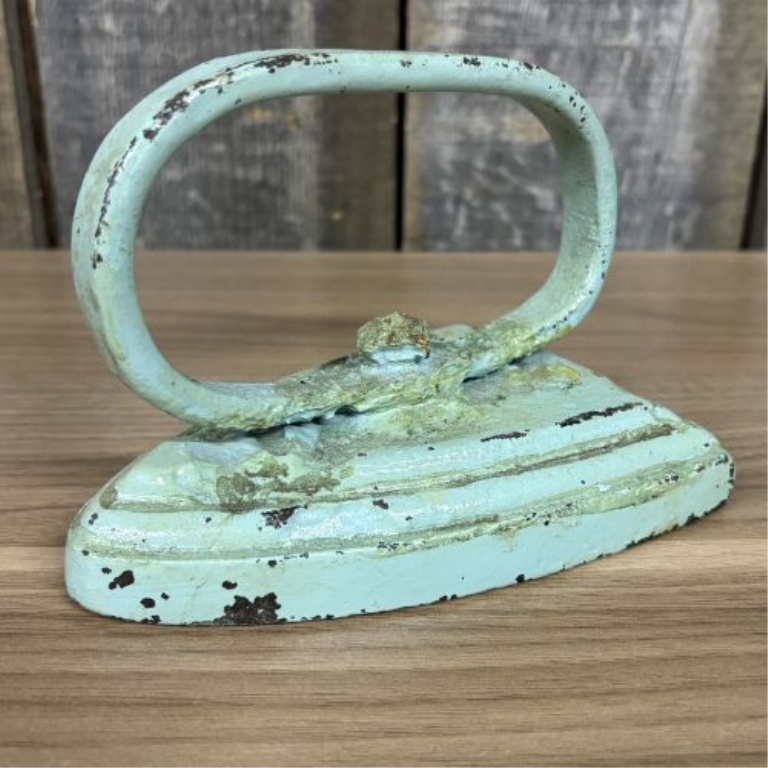 A Pair of Antique Cast Iron Miniature Sad Iron and Matching Footed Trivet