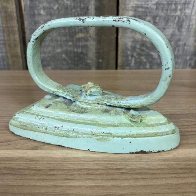 A Pair of Antique Cast Iron Miniature Sad Iron and Matching Footed Trivet