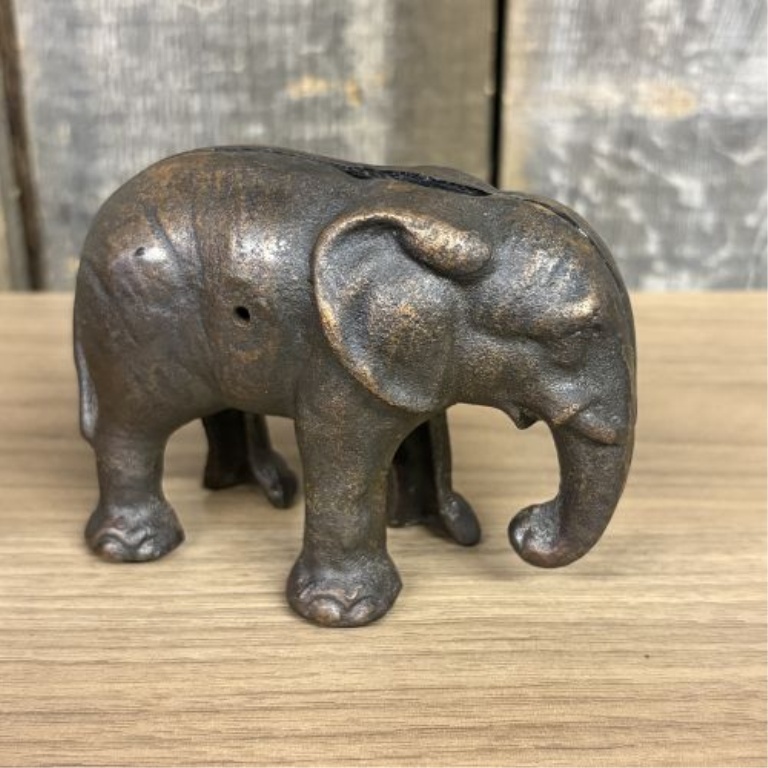Two Elephant Figurines including a Still Bank and a Trunk Up Figure