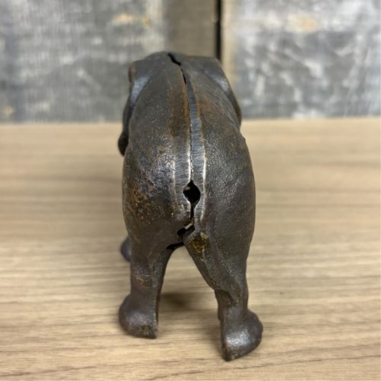 Two Elephant Figurines including a Still Bank and a Trunk Up Figure