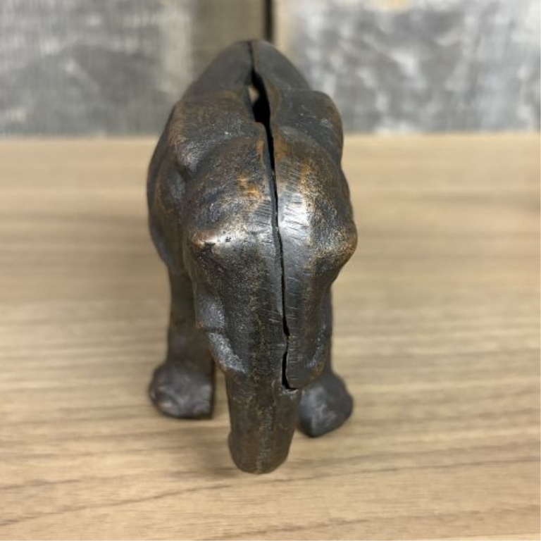 Two Elephant Figurines including a Still Bank and a Trunk Up Figure