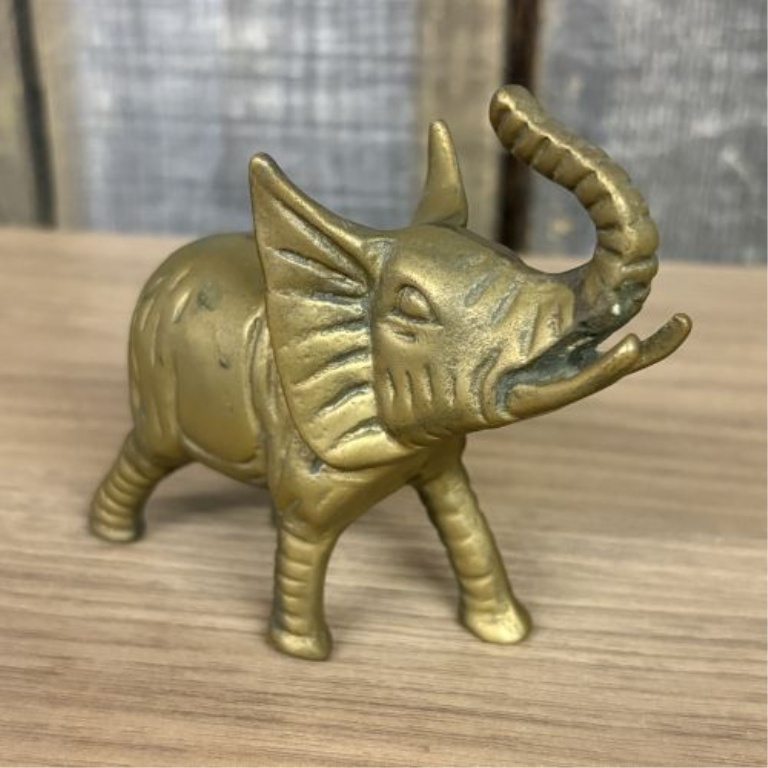 Two Elephant Figurines including a Still Bank and a Trunk Up Figure