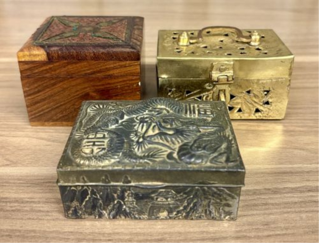 A Trio of Asian Style Decorative Metal and Wood Trinket Boxes