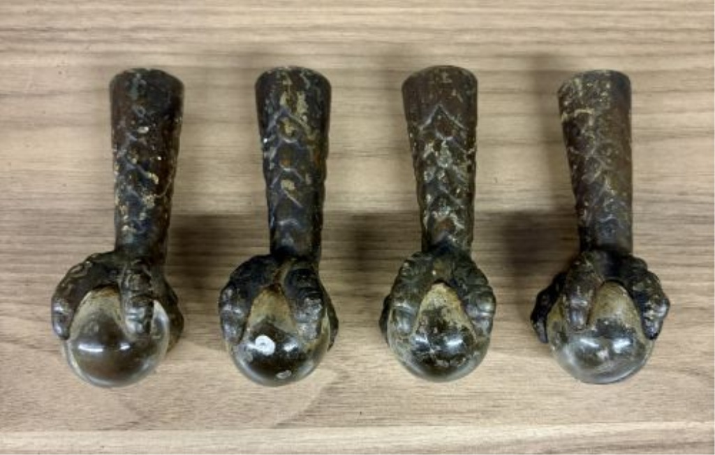 A Set of Antique Cast Iron and Glass Ball Claw Ferrule Feet