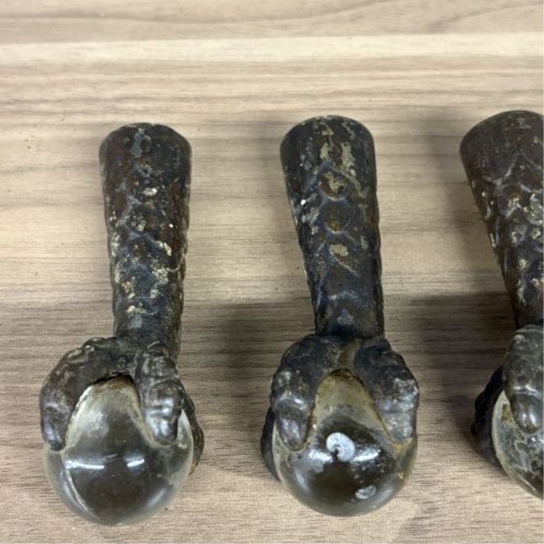 A Set of Antique Cast Iron and Glass Ball Claw Ferrule Feet