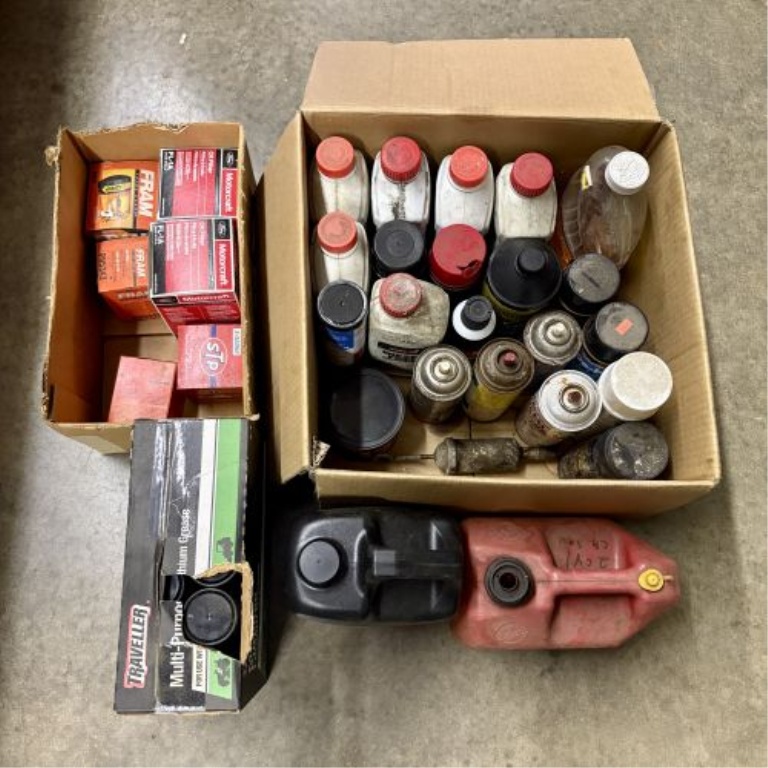 An Assortment of Automotive Maintenance Supplies, Lubricants, and Workshop Accessories