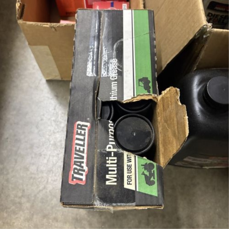 An Assortment of Automotive Maintenance Supplies, Lubricants, and Workshop Accessories