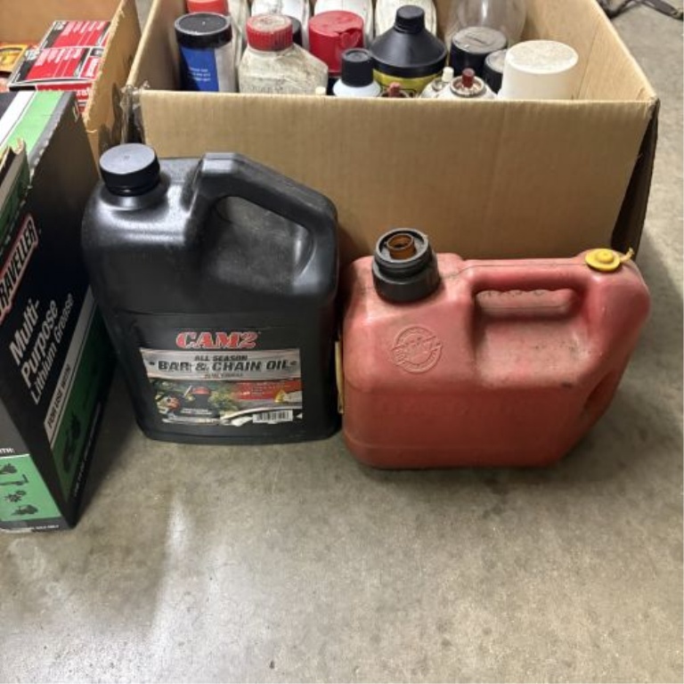 An Assortment of Automotive Maintenance Supplies, Lubricants, and Workshop Accessories
