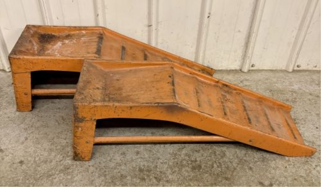 A Pair of Vintage Orange Stamped Steel Automotive Service Ramps