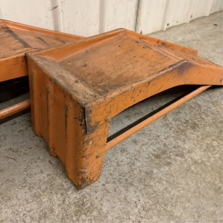 A Pair of Vintage Orange Stamped Steel Automotive Service Ramps