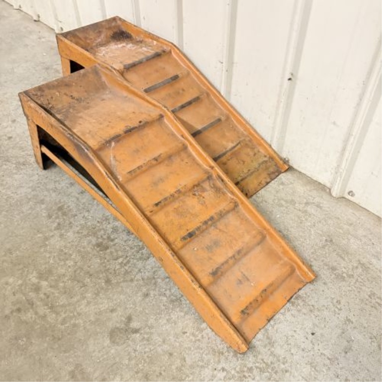 A Pair of Vintage Orange Stamped Steel Automotive Service Ramps