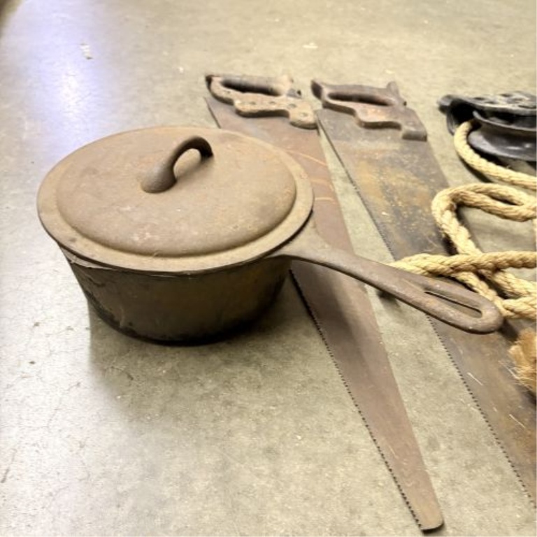 A Collection of Antique and Vintage Utilitarian Items Including Hand Saws and Cast Iron Hardware