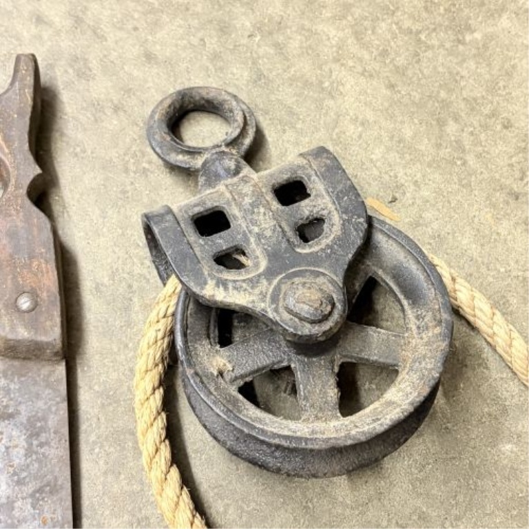 A Collection of Antique and Vintage Utilitarian Items Including Hand Saws and Cast Iron Hardware