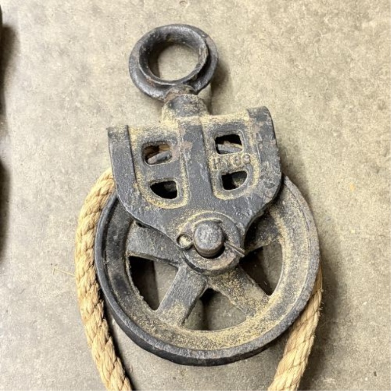 A Collection of Antique and Vintage Utilitarian Items Including Hand Saws and Cast Iron Hardware