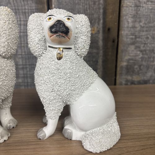 A Pair of Staffordshire Confetti Poodle Figurines