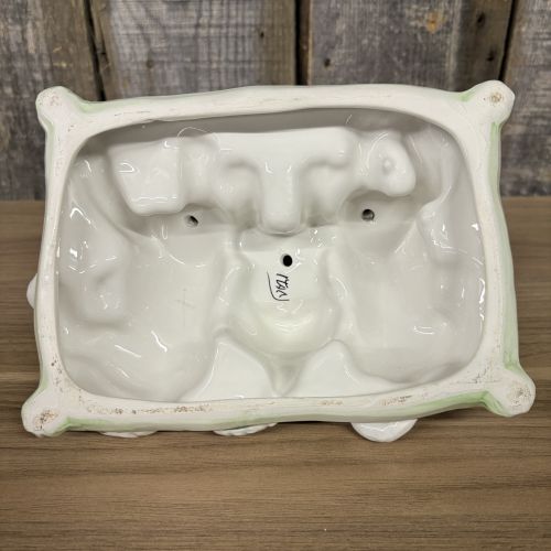 A Trio of Italian Majolica Porcelain Puppies on a Cushion