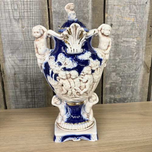 A Pair of Norleans Italy Cobalt Blue and Gilt Ceramic Lidded Urns with Cherub Relief