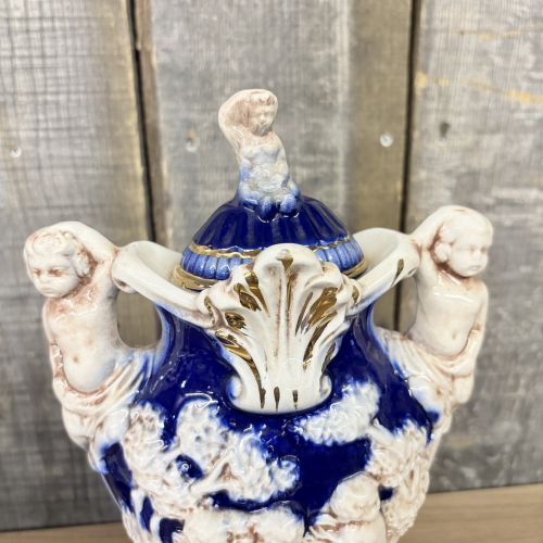 A Pair of Norleans Italy Cobalt Blue and Gilt Ceramic Lidded Urns with Cherub Relief
