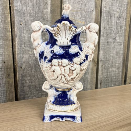 A Pair of Norleans Italy Cobalt Blue and Gilt Ceramic Lidded Urns with Cherub Relief