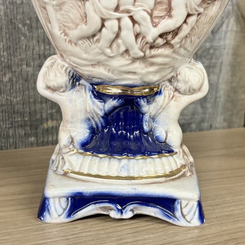 A Pair of Norleans Italy Cobalt Blue and Gilt Ceramic Lidded Urns with Cherub Relief