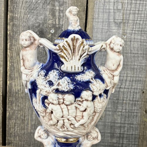 A Pair of Norleans Italy Cobalt Blue and Gilt Ceramic Lidded Urns with Cherub Relief