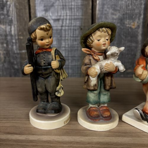 Set of Four Goebel Hummel Hand-Painted Porcelain Figurines