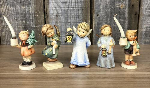 A Set of Five Goebel M.I. Hummel Christmas Themed Ceramic Figurines