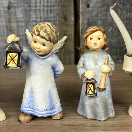 A Set of Five Goebel M.I. Hummel Christmas Themed Ceramic Figurines