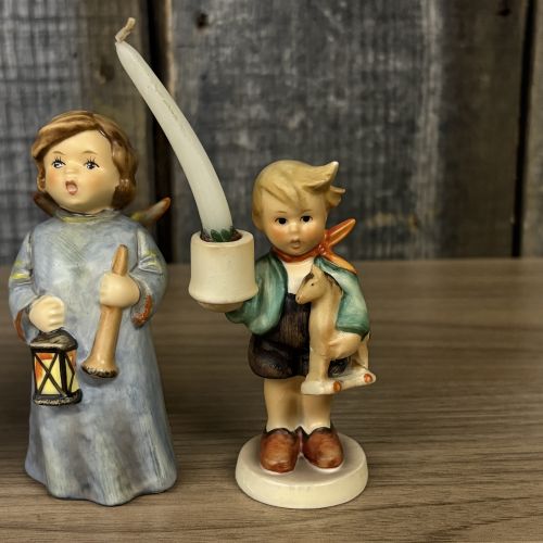 A Set of Five Goebel M.I. Hummel Christmas Themed Ceramic Figurines