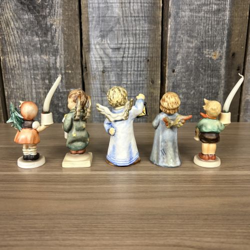 A Set of Five Goebel M.I. Hummel Christmas Themed Ceramic Figurines