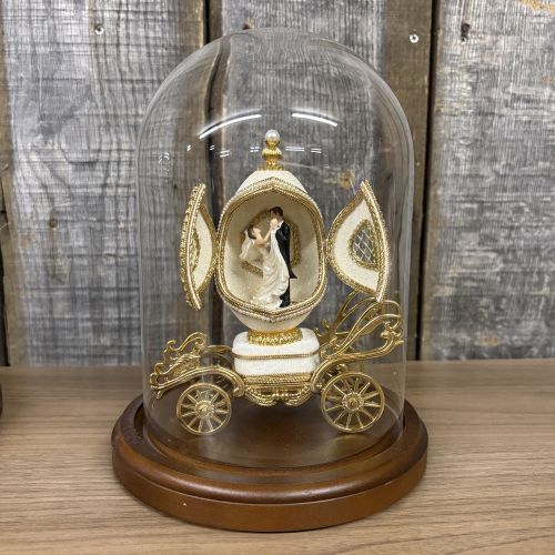 A Pair of Musical Faberge Style Wedding Carriage Egg Figurines with Glass Cloches