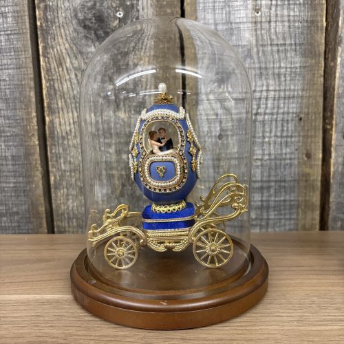 A Pair of Musical Faberge Style Wedding Carriage Egg Figurines with Glass Cloches