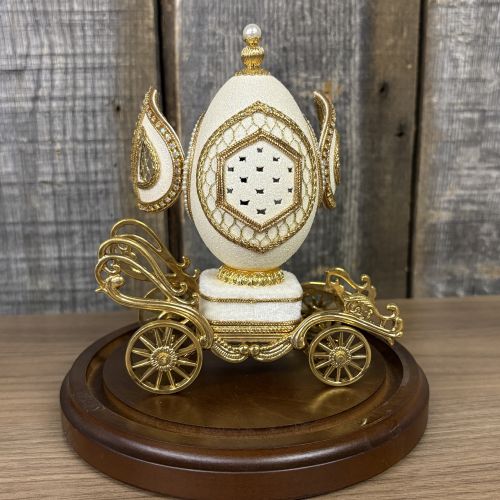 A Pair of Musical Faberge Style Wedding Carriage Egg Figurines with Glass Cloches