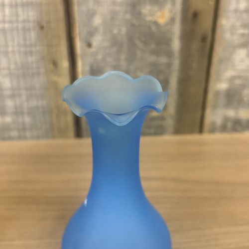 Two Mary Gregory Glass Items Including an Amber Decanter and a Frosted Blue Vase