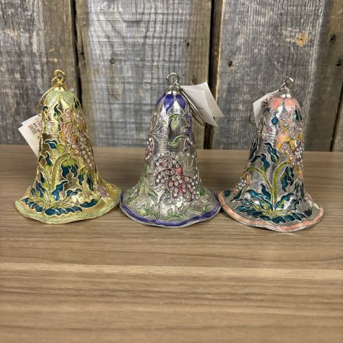 An Assortment of Seven Decorative Porcelain, Glass, and Enameled Metal Bells